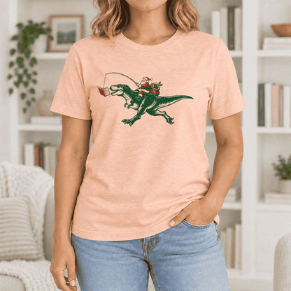 Santa Riding T-Rex Ultra-Soft Cotton T-Shirt | Christmas Reader Gift Heather Peach