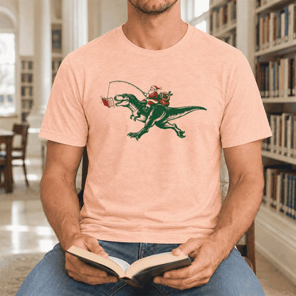 Santa Riding T-Rex Ultra-Soft Cotton T-Shirt | Christmas Reader Gift Heather Peach