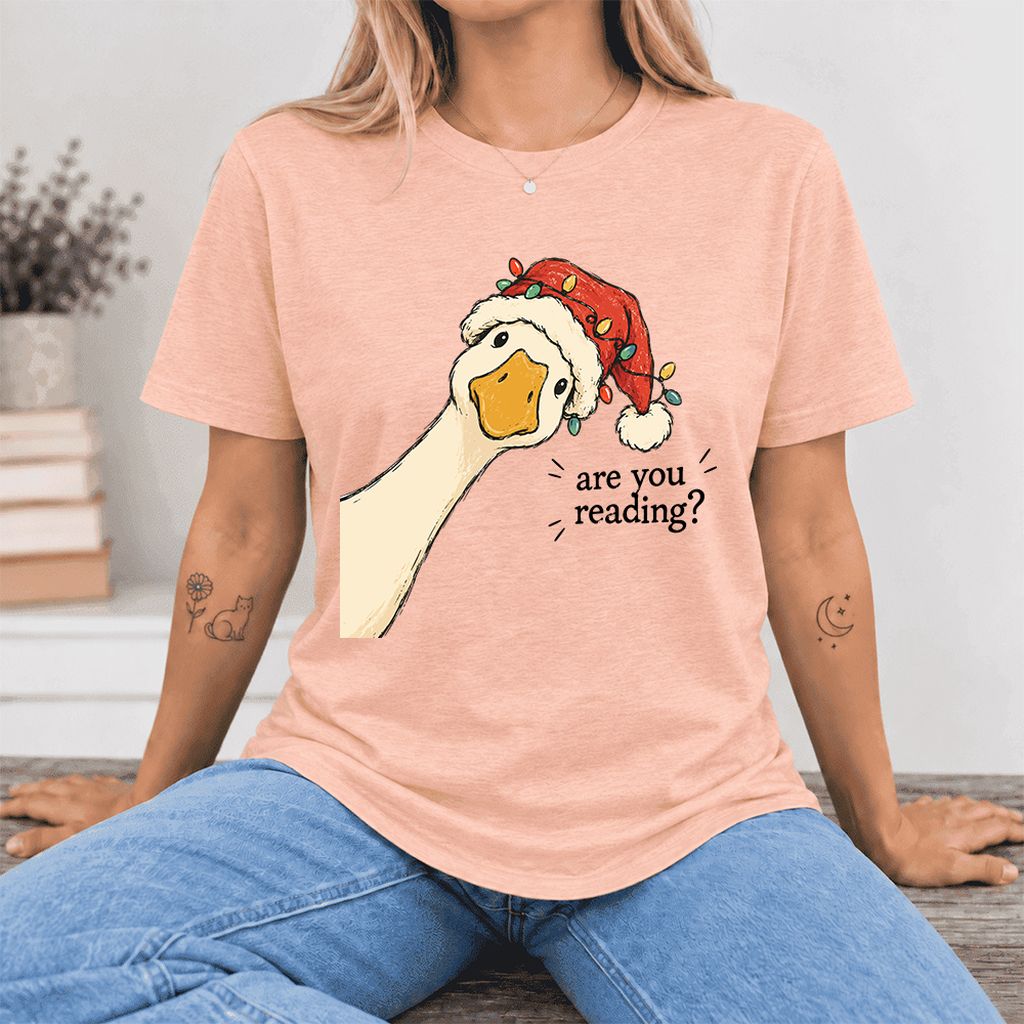 Are You Reading Goose Ultra-Soft Cotton T-Shirt | Christmas Book Lover Gift Heather Peach