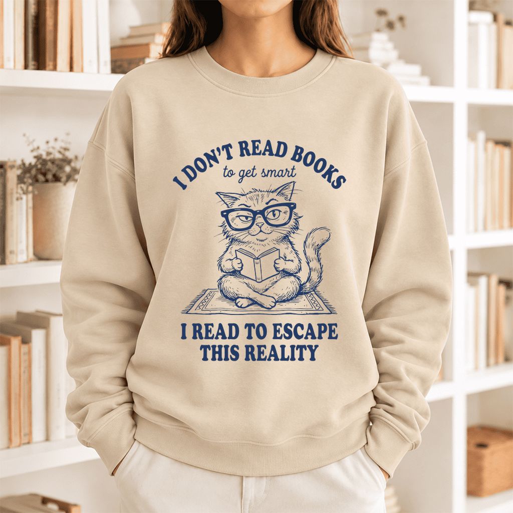 I Don't Read Books To Escape This Reality Softstyle Sweatshirt | Book Lover Gift Sand