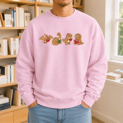 Four Gingerbread Dinosaur Reading Printed Sweatshirt | Christmas Reading Gift Light Pink