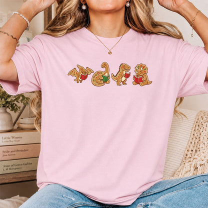 Four Gingerbread Dinosaur Reading Printed T-Shirt | Christmas Reading Gift Light Pink