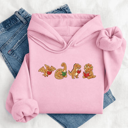Four Gingerbread Dinosaur Reading Softstyle Hoodie | Christmas Reading Gift Light Pink