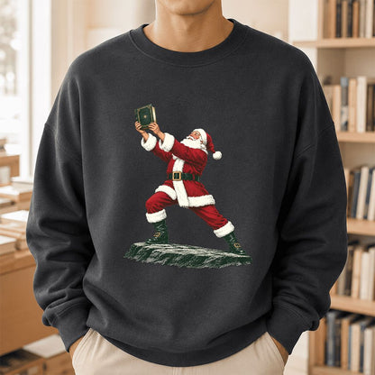 Santa Claus Holding Up A Green Book Printed Sweatshirt | Christmas Gift Dark Heather