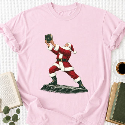 Santa Claus Holding Up A Green Book Printed T-Shirt | Christmas Gift Light Pink