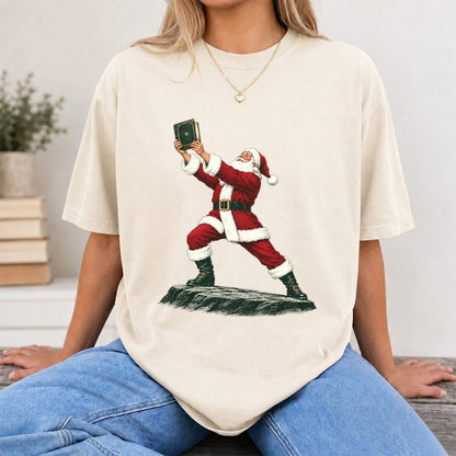 Santa Claus Holding Up A Green Book Printed T-Shirt | Christmas Gift Natural
