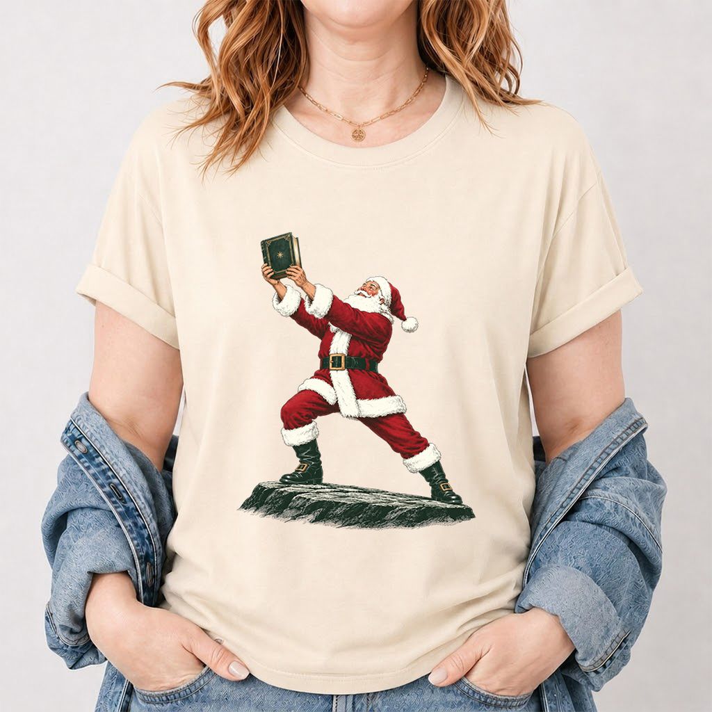 Santa Claus Holding Up A Green Book Printed T-Shirt | Christmas Gift Natural