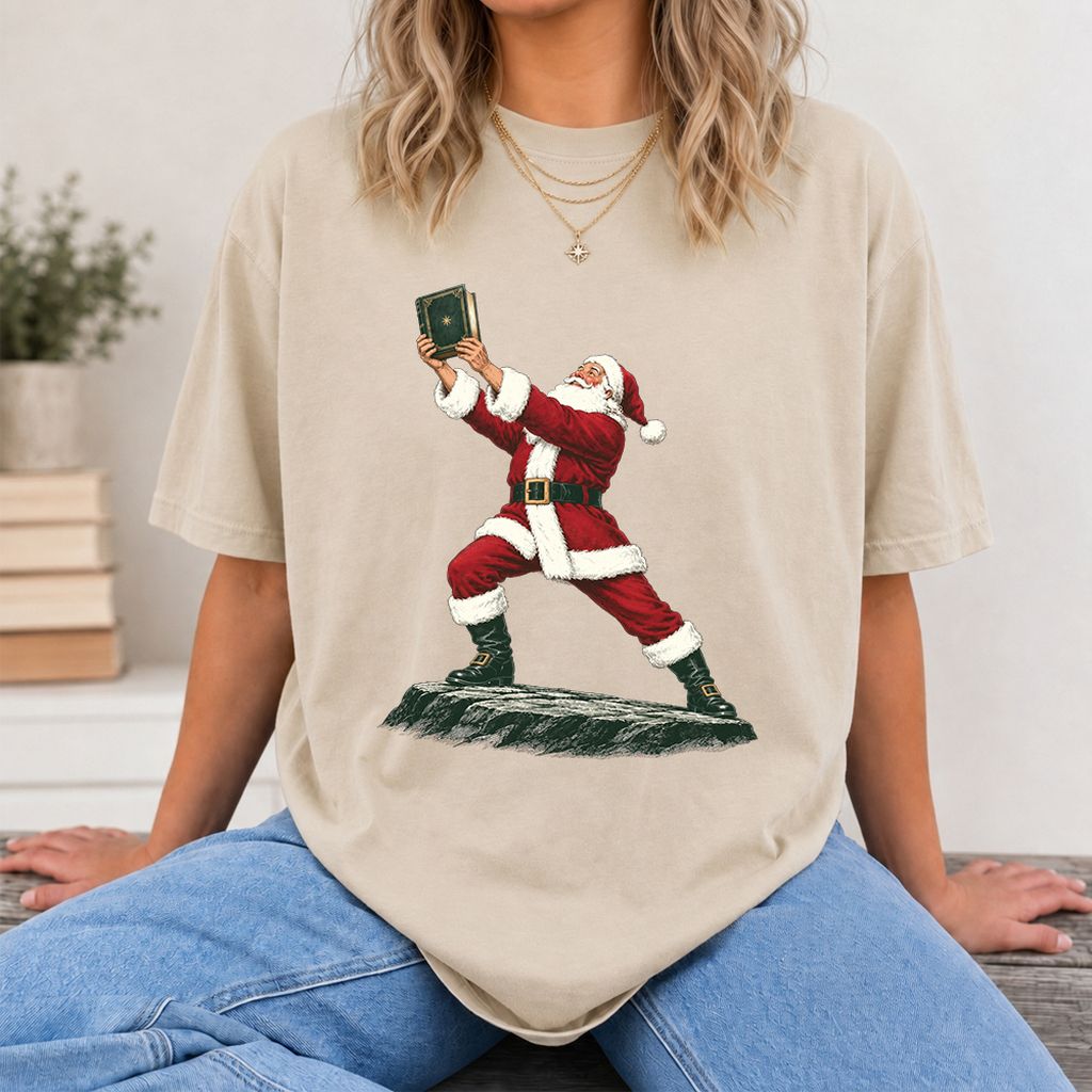 Santa Claus Holding Up A Green Book Printed T-Shirt | Christmas Gift Sand