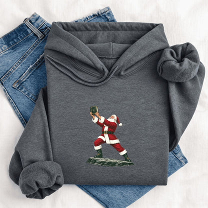 Santa Claus Holding Up A Green Book Softstyle Hoodie | Christmas Gift Dark Heather