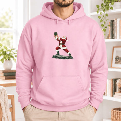Santa Claus Holding Up A Green Book Softstyle Hoodie | Christmas Gift Light Pink