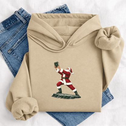 Santa Claus Holding Up A Green Book Softstyle Hoodie | Christmas Gift Sand
