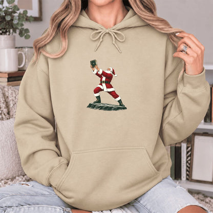 Santa Claus Holding Up A Green Book Softstyle Hoodie | Christmas Gift Sand