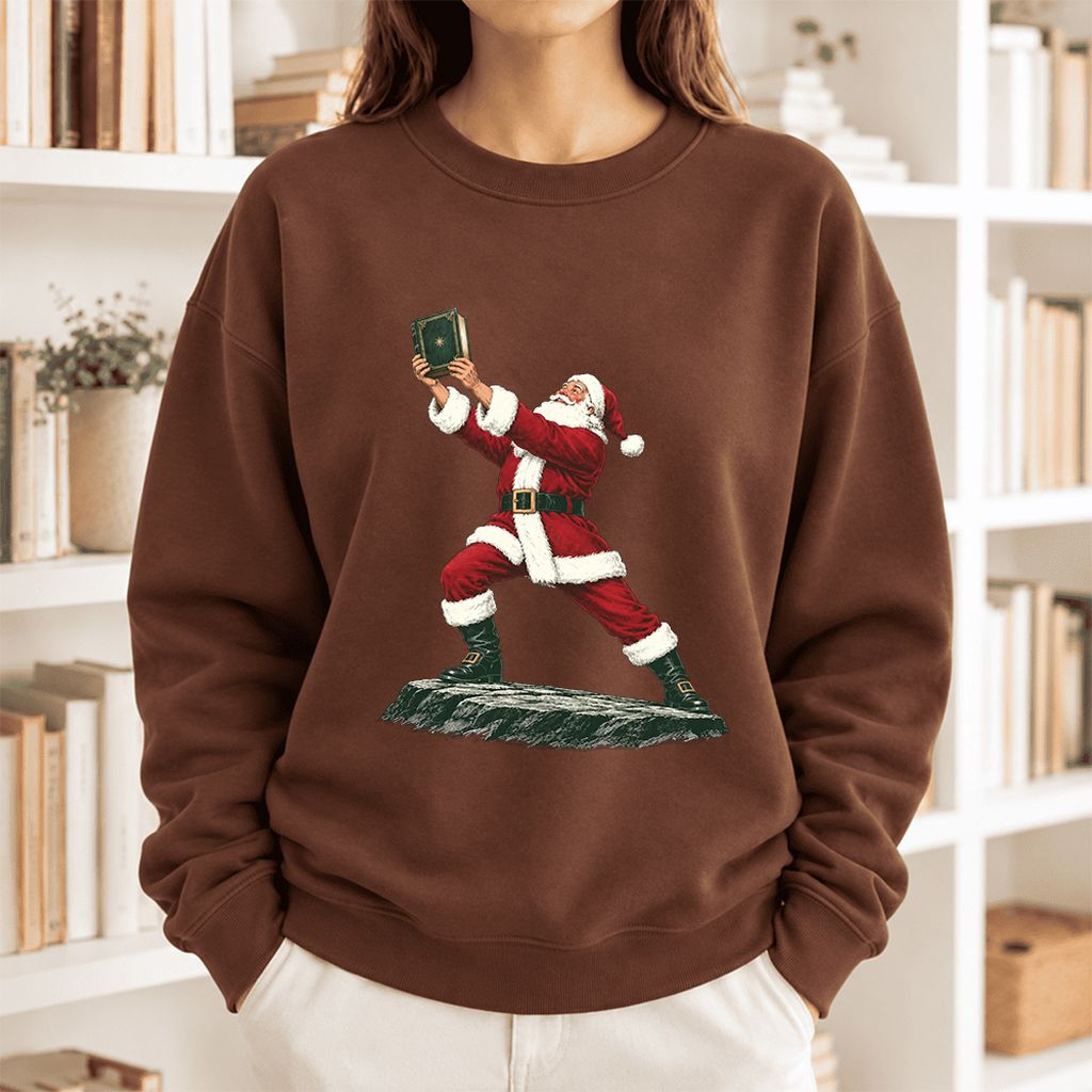 Santa Claus Holding Up A Green Book Softstyle Sweatshirt | Christmas Gift Cocoa