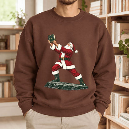 Santa Claus Holding Up A Green Book Softstyle Sweatshirt | Christmas Gift Cocoa
