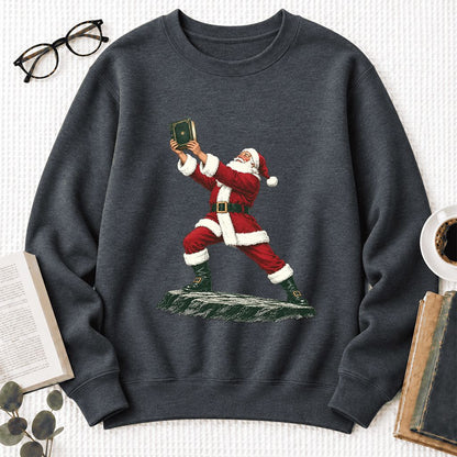 Santa Claus Holding Up A Green Book Softstyle Sweatshirt | Christmas Gift Dark Heather
