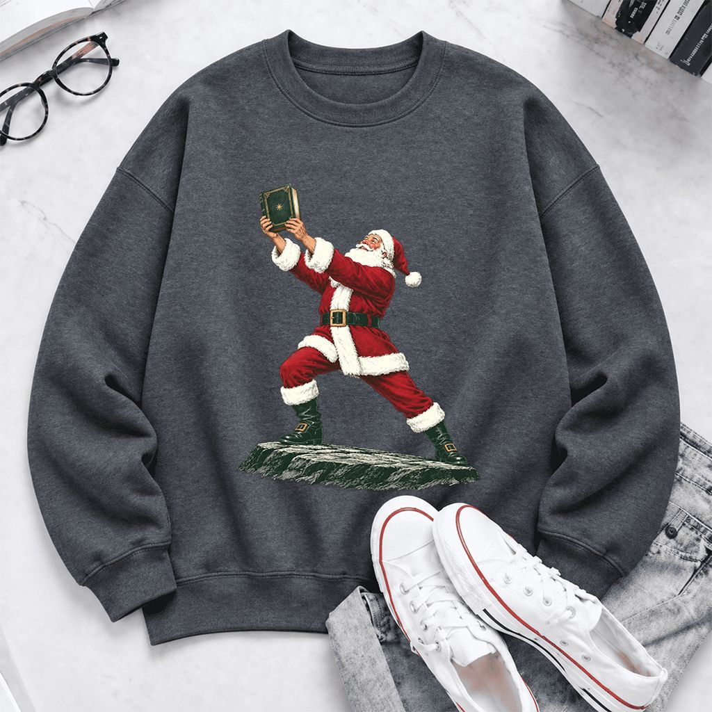 Santa Claus Holding Up A Green Book Softstyle Sweatshirt | Christmas Gift Dark Heather