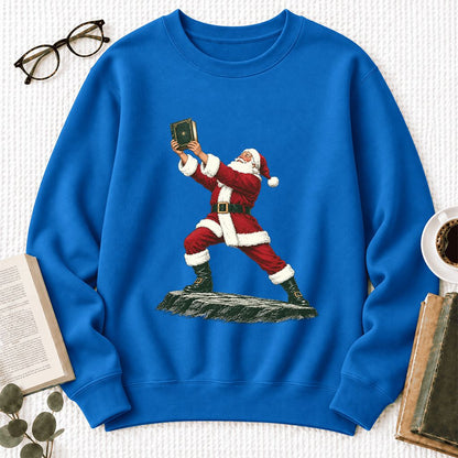 Santa Claus Holding Up A Green Book Softstyle Sweatshirt | Christmas Gift Royal
