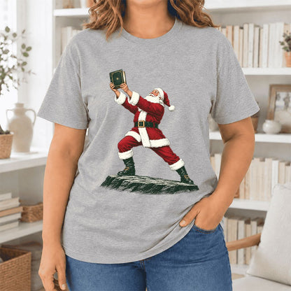 Santa Claus Holding Up A Green Book Ultra-Soft Cotton T-Shirt | Christmas Gift Athletic Heather