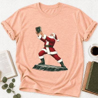 Santa Claus Holding Up A Green Book Ultra-Soft Cotton T-Shirt | Christmas Gift Heather Peach