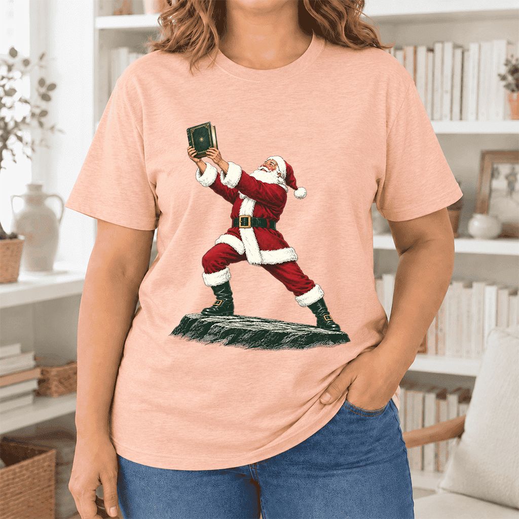 Santa Claus Holding Up A Green Book Ultra-Soft Cotton T-Shirt | Christmas Gift Heather Peach