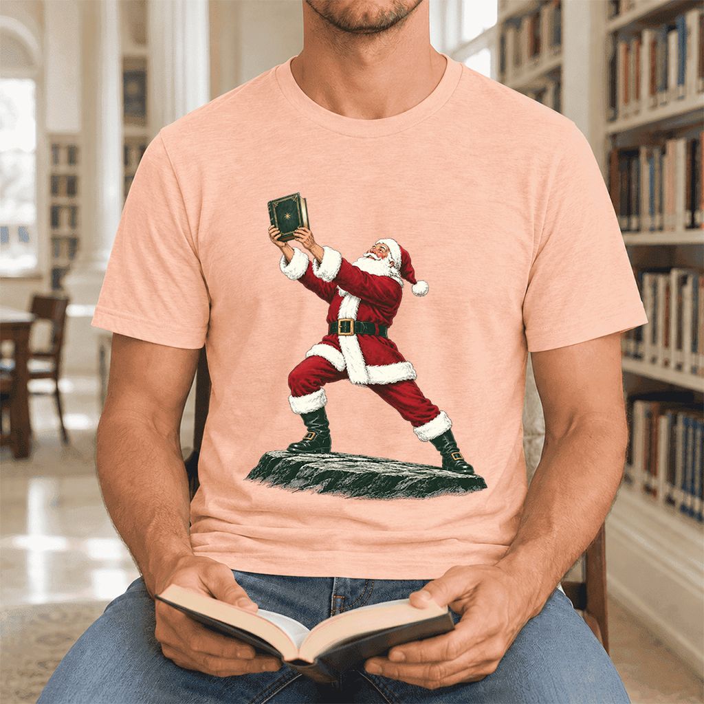 Santa Claus Holding Up A Green Book Ultra-Soft Cotton T-Shirt | Christmas Gift Heather Peach