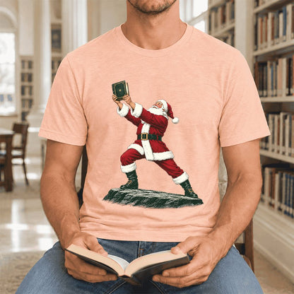 Santa Claus Holding Up A Green Book Ultra-Soft Cotton T-Shirt | Christmas Gift Heather Peach
