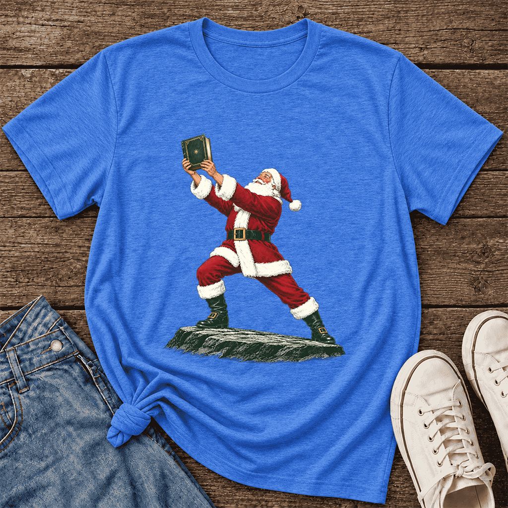 Santa Claus Holding Up A Green Book Ultra-Soft Cotton T-Shirt | Christmas Gift Heather True Royal