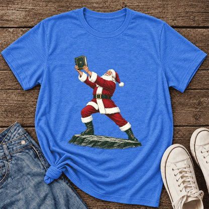 Santa Claus Holding Up A Green Book Ultra-Soft Cotton T-Shirt | Christmas Gift Heather True Royal
