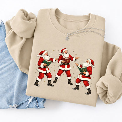 Three Reading Santas Softstyle Sweatshirt | Christmas Reader Gift Sand