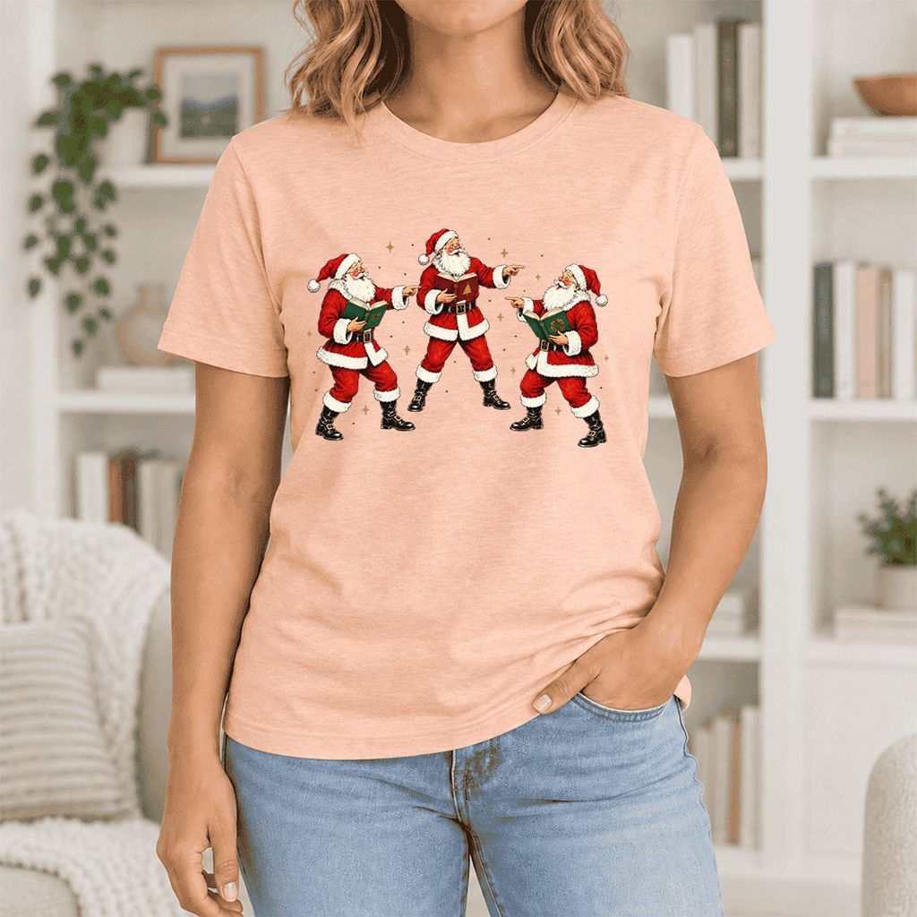 Three Reading Santas Ultra-Soft Cotton T-Shirt | Christmas Reader Gift Heather Peach