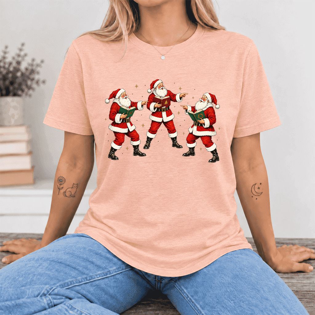 Three Reading Santas Ultra-Soft Cotton T-Shirt | Christmas Reader Gift Heather Peach