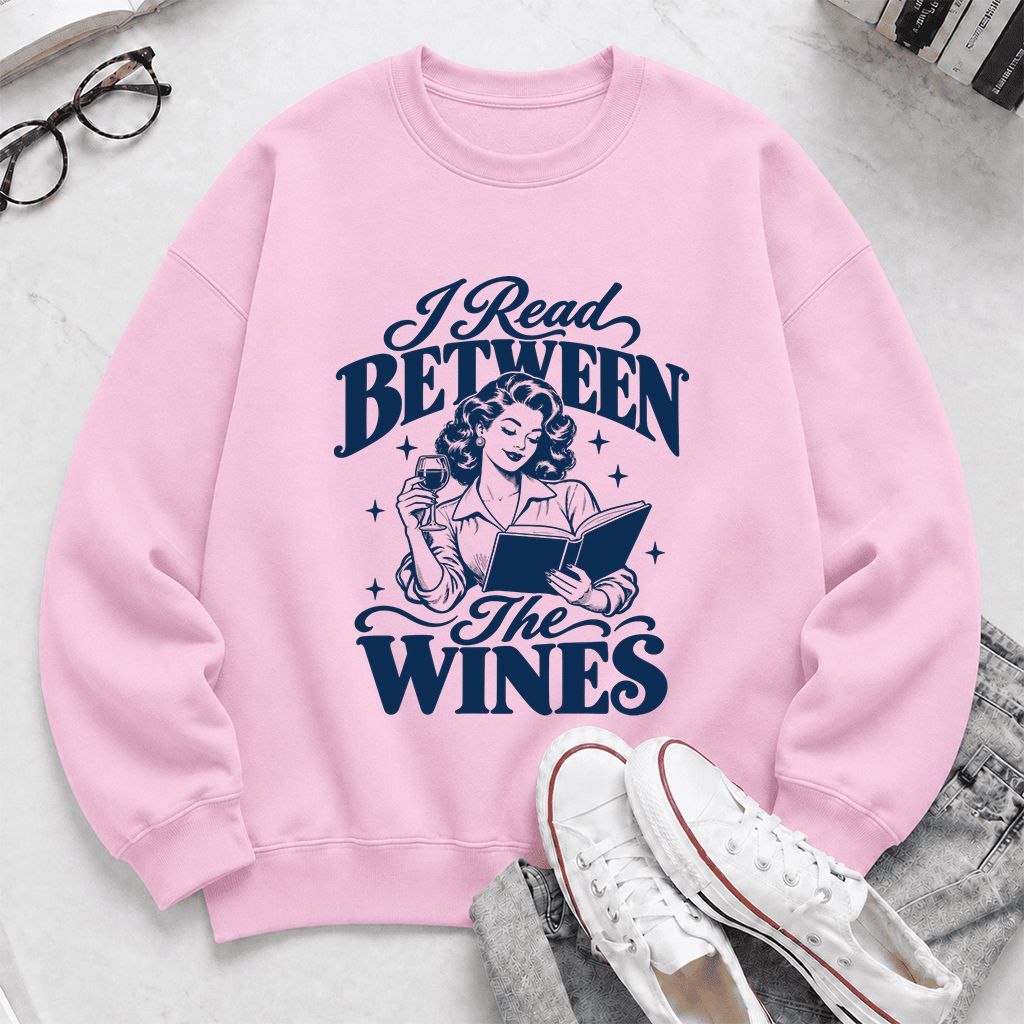 I Read Between The Wines Printed Sweatshirt | Cozy Book Lover Gift Light Pink