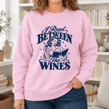 I Read Between The Wines Printed Sweatshirt | Cozy Book Lover Gift Light Pink