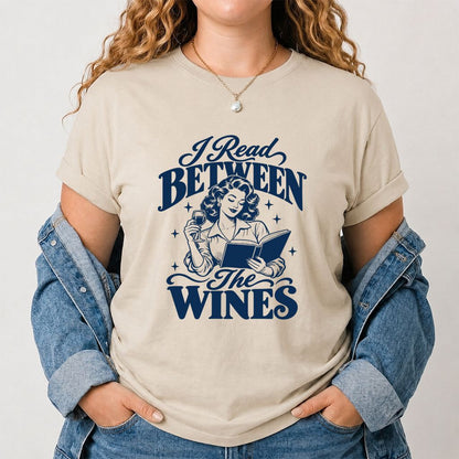 I Read Between The Wines Printed T-Shirt | Cozy Book Lover Gift Sand