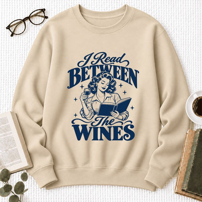I Read Between The Wines Softstyle Sweatshirt | Cozy Book Lover Gift Sand
