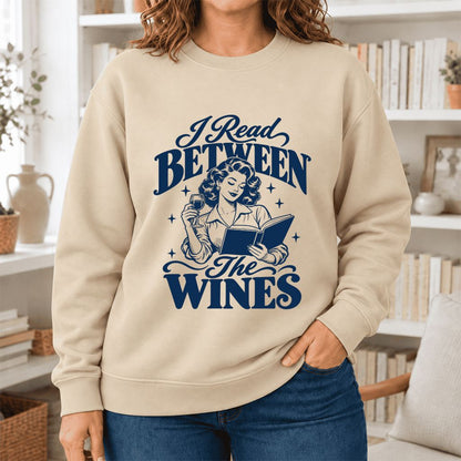 I Read Between The Wines Softstyle Sweatshirt | Cozy Book Lover Gift Sand