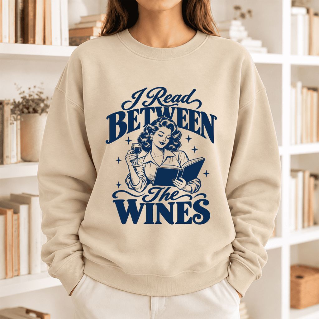 I Read Between The Wines Softstyle Sweatshirt | Cozy Book Lover Gift Sand