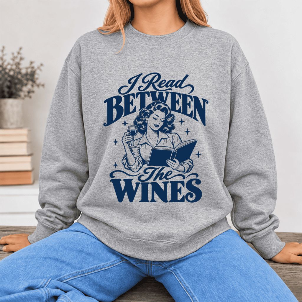 I Read Between The Wines Softstyle Sweatshirt | Cozy Book Lover Gift Sport Grey