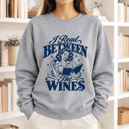 I Read Between The Wines Softstyle Sweatshirt | Cozy Book Lover Gift Sport Grey