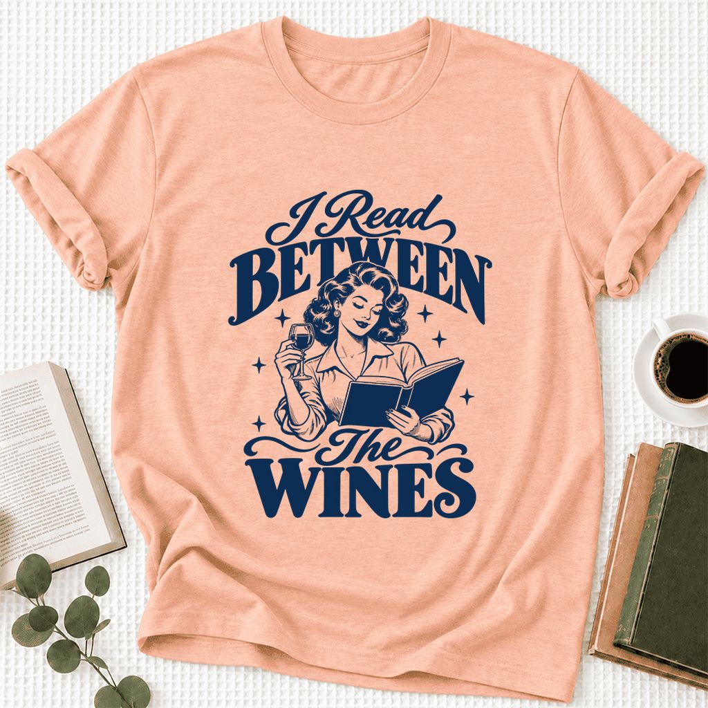I Read Between The Wines Ultra-Soft Cotton T-Shirt | Cozy Book Lover Gift Heather Peach