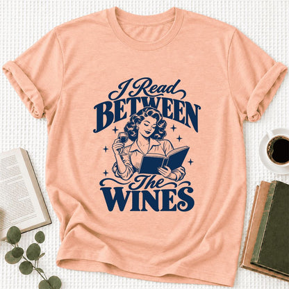 I Read Between The Wines Ultra-Soft Cotton T-Shirt | Cozy Book Lover Gift Heather Peach