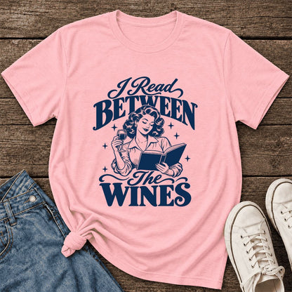 I Read Between The Wines Ultra-Soft Cotton T-Shirt | Cozy Book Lover Gift Pink