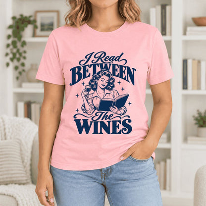 I Read Between The Wines Ultra-Soft Cotton T-Shirt | Cozy Book Lover Gift Pink
