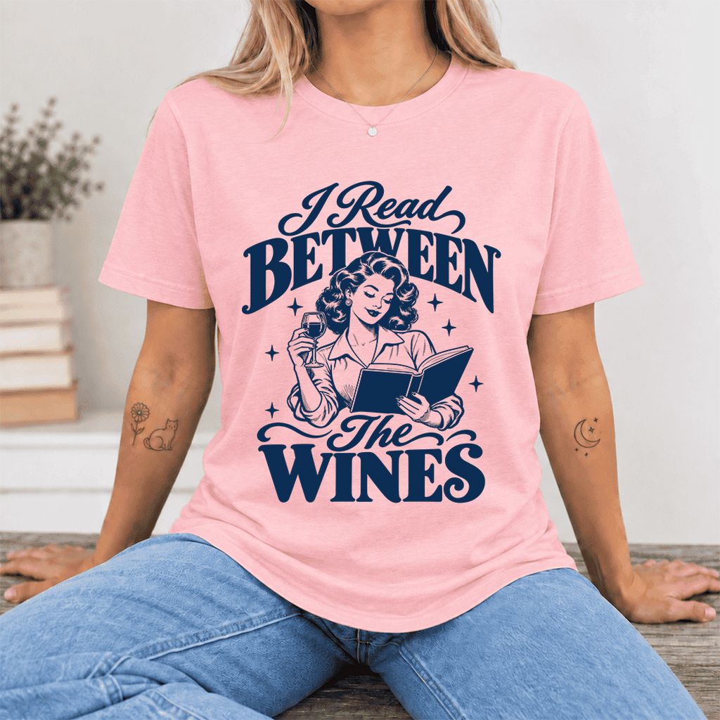 I Read Between The Wines Ultra-Soft Cotton T-Shirt | Cozy Book Lover Gift Pink