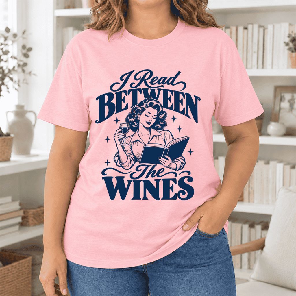 I Read Between The Wines Ultra-Soft Cotton T-Shirt | Cozy Book Lover Gift Pink
