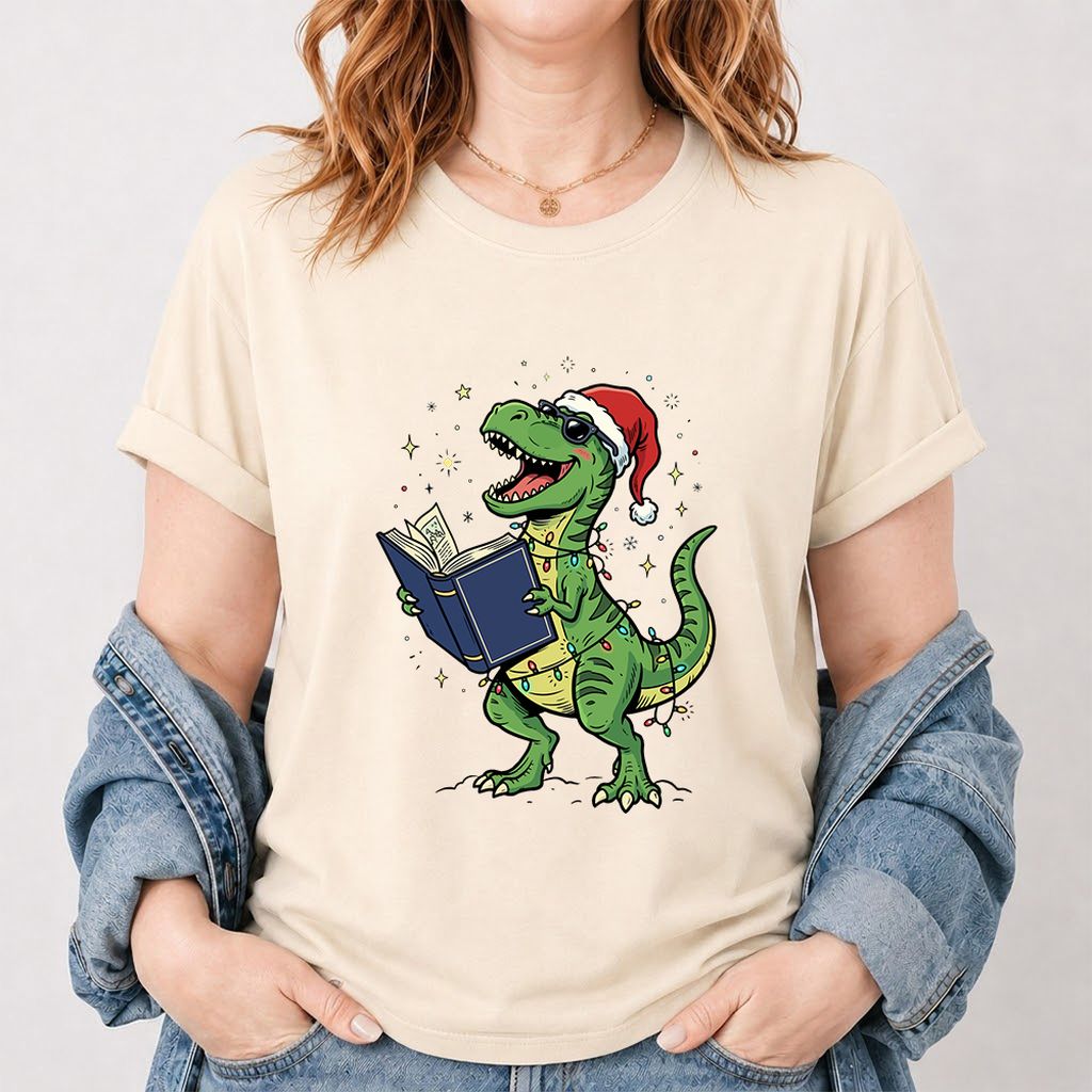 T-Rex Wearing Santa Hat And Reading Printed T-Shirt | Christmas Reader Gift Natural
