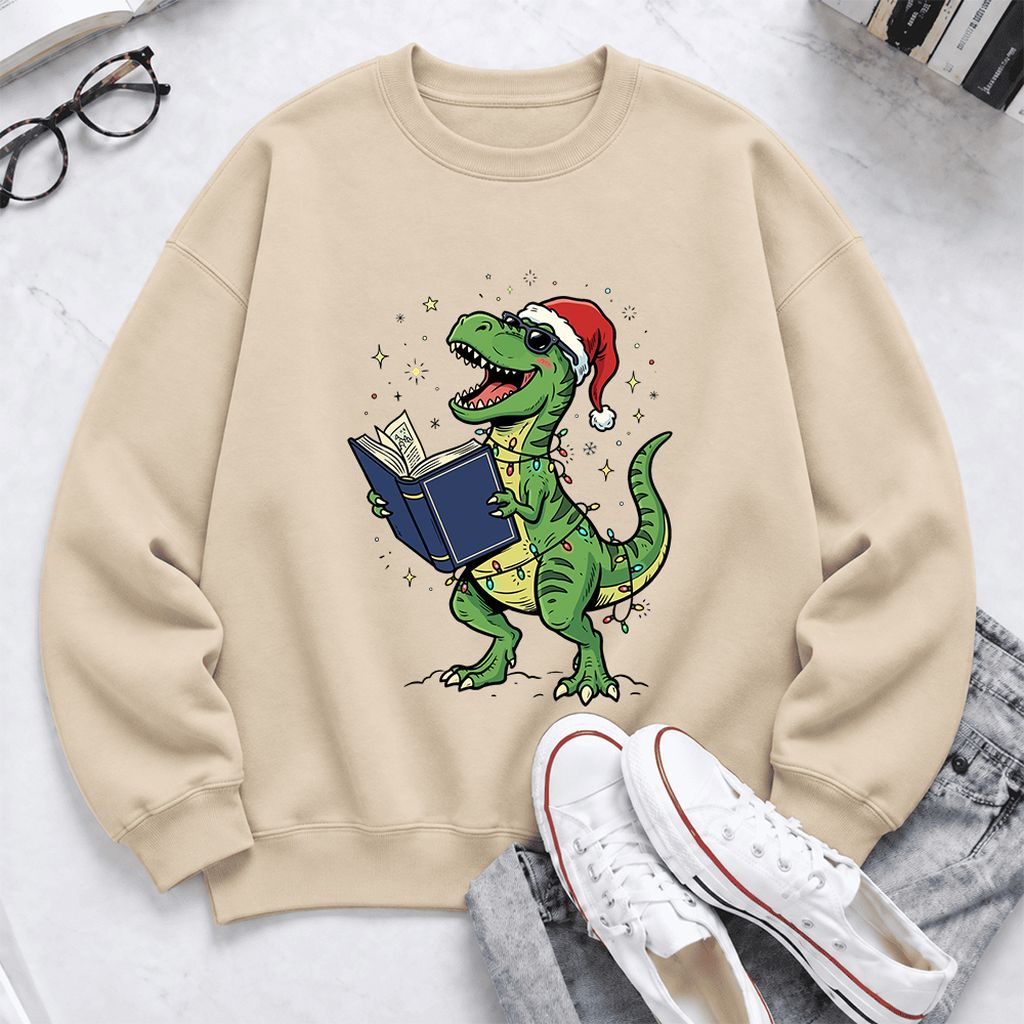 T-Rex Wearing Santa Hat And Reading Softstyle Sweatshirt | Christmas Reader Gift Sand