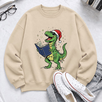 T-Rex Wearing Santa Hat And Reading Softstyle Sweatshirt | Christmas Reader Gift Sand