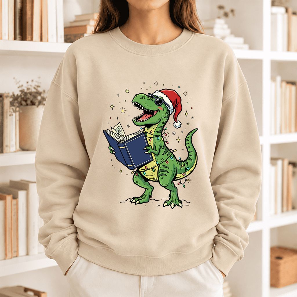T-Rex Wearing Santa Hat And Reading Softstyle Sweatshirt | Christmas Reader Gift Sand