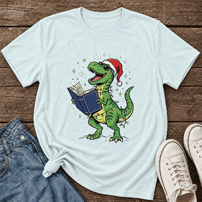 T-Rex Wearing Santa Hat And Reading Ultra-Soft Cotton T-Shirt | Christmas Gift Heather Ice Blue